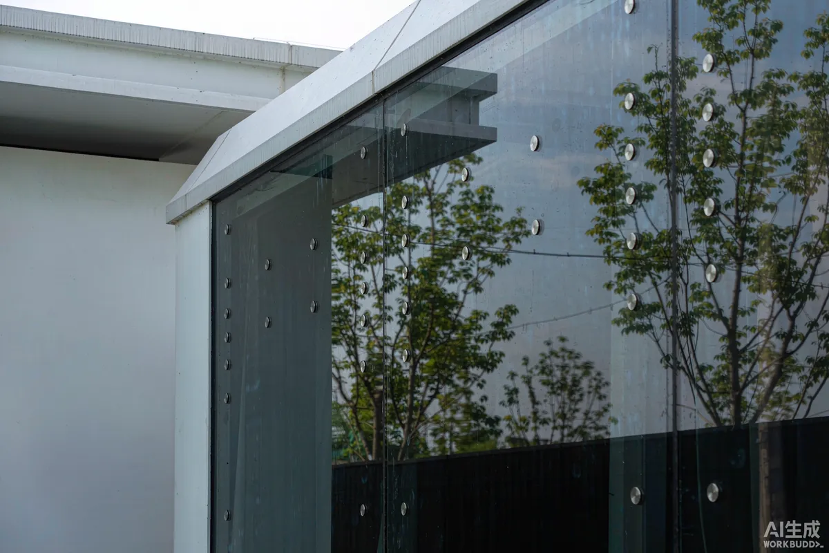 Panoramic glazing of a capsule home reflecting trees and sky, with small bird deterrent markers on the glass