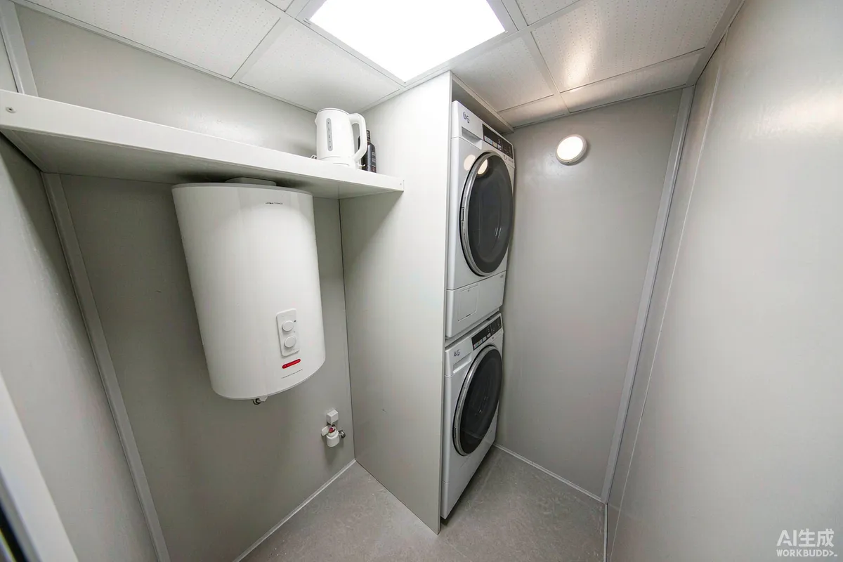 Service wall in a capsule home with a compact water heater and stacked washer dryer beside plumbing connections