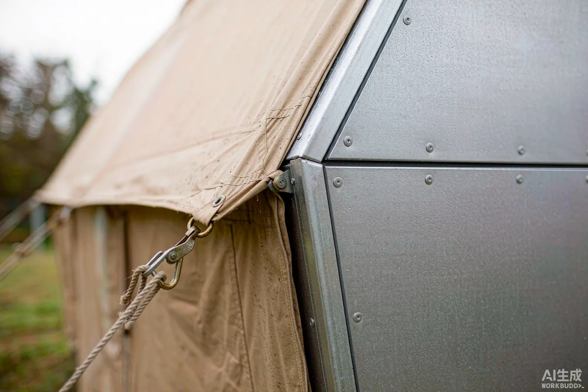Close-up of a canvas safari tent seam and tensioning hardware beside an insulated capsule home wall panel