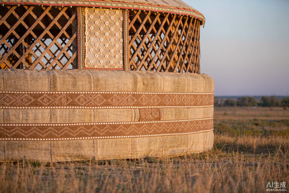 Close view of a yurt tension band and wooden lattice wall in dry grassland at low afternoon sun